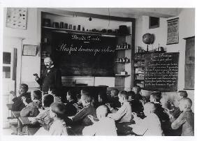 Children in a classroom (b/w photo) 