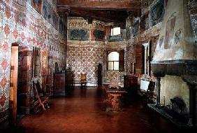 Bedroom or Sala dei Pavoni with frescoed trompe l'oeil decoration of wall hangings and a frieze of b 14th centu