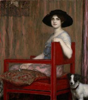 Mary von Stuck in einem roten Sessel 1916
