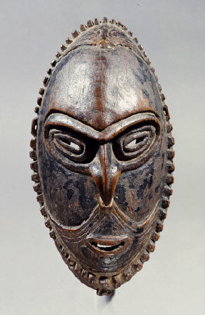A New Guinea Mask Of Oval Form With Pierced Eyes, Mouth And Septum von 