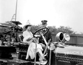 Woman driving a firefighter truck 20's